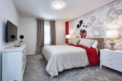 a bedroom with a mickey mouse mural on the wall at 5 Bedrooms Townhome W- Splashpool - 8205Sa in Orlando