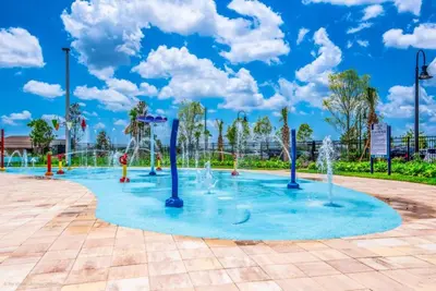a playground with water fountains in a park at Comfortable Spacious-6 Bed Pool Home - 1675Str in Kissimmee