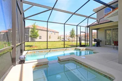 a swimming pool in a house with a glass ceiling at Pool Home With Privacy, Bbq, Mickey Room - 3500Pp in Kissimmee
