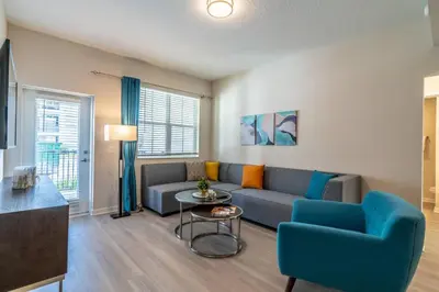 a living room with a couch and a table at 4013 Vista Cay in Orlando