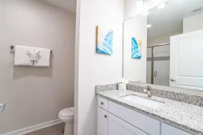 a bathroom with a sink and a toilet at 4013 Vista Cay in Orlando
