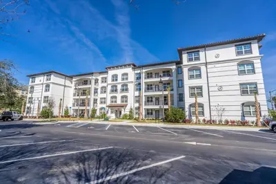 an apartment building with a parking lot at 4013 Vista Cay in Orlando