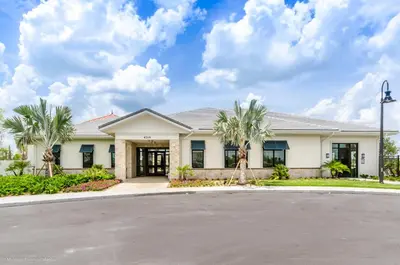 a house with palm trees in the driveway at Villa wPrivate Pool &Themed Rooms, near Disney in Kissimmee