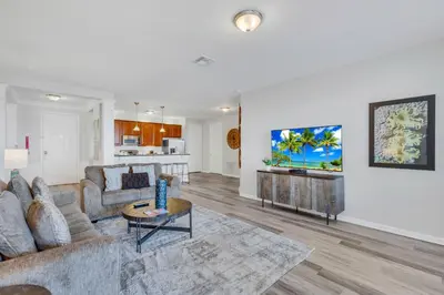 a living room with a couch and a table at 4816 Cayview Ave #306 in Orlando