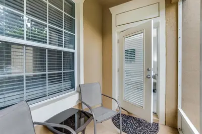 a room with two chairs and a window at 7664 Comrow Street #104 in Orlando