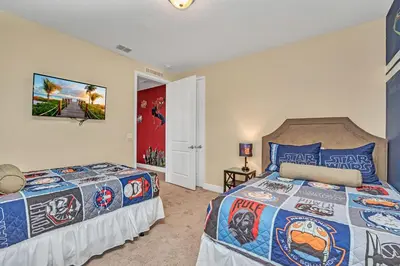 a bedroom with two beds in a room at Modern Villa wPrivate Pool and Air Hockey Table in Orlando