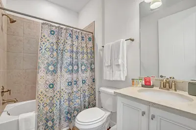 a bathroom with a toilet and a sink and a shower at Large Margaritaville Villa w PRIVATE POOL View in Orlando