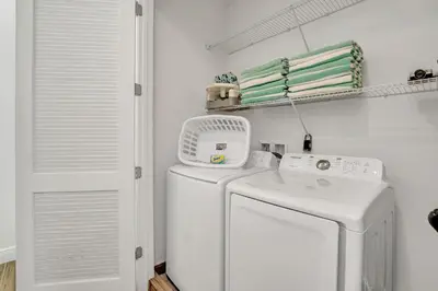 a white washer and dryer in a laundry room at Large Margaritaville Villa w PRIVATE POOL View in Orlando