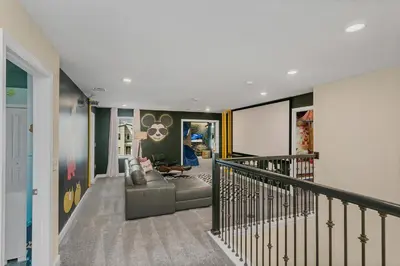 a living room with a couch and a stair case at 4520 Target Blvd in Kissimmee