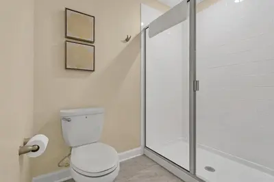 a bathroom with a toilet and a shower at 4520 Target Blvd in Kissimmee