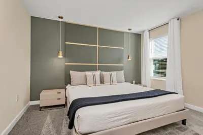 a bedroom with a large bed and a window at 4520 Target Blvd in Kissimmee