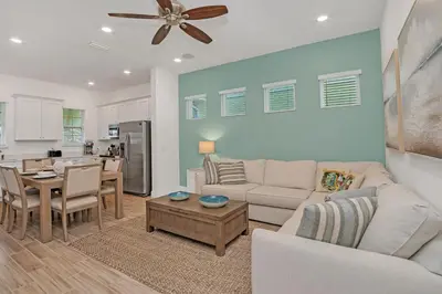 a living room with a couch and a table at Gorgeous Margaritaville Cottage wPrivate Patio in Orlando