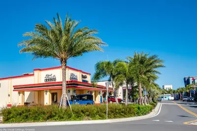 a palm tree in front of a fast food restaurant at Gorgeous Margaritaville Cottage wPrivate Patio in Orlando