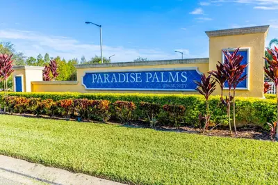a building with a sign that reads paradise palms at Spetacular TownHome With Private Pool close to Disney 8919PP in Kissimmee