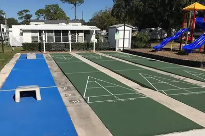 an image of a tennis court with a playground at Cozy Tiny Home Near Disney World & Orlando Parks! in Kissimmee