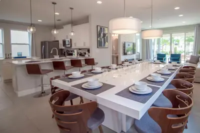 a large dining room with a long table and chairs at Encore Resort 6 Bedroom Vacation Home with Pool (2102) in Orlando