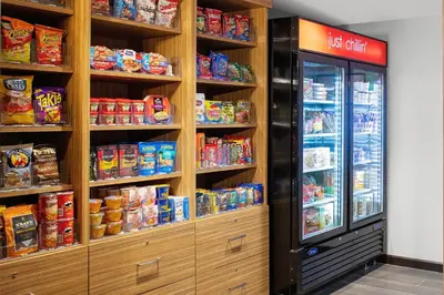 a store with a lot of shelves filled with food at TownePlace Suites by Marriott Orlando Airport in Orlando