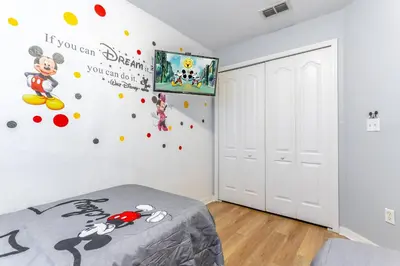 a bedroom with mickey mouse decals on the wall at 17637 Silver Creek in Orlando
