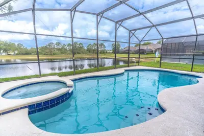 a large swimming pool in a large building with a pond at 17637 Silver Creek in Orlando