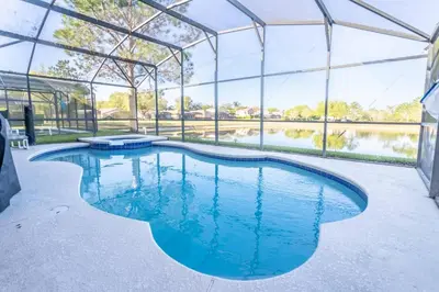 an indoor swimming pool in a marquee with blue water at 17637 Silver Creek in Orlando