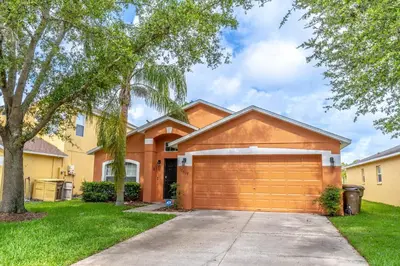 a house with a garage in a yard at 17637 Silver Creek in Orlando