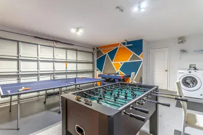a ping pong room with two ping pong tables at 17637 Silver Creek in Orlando