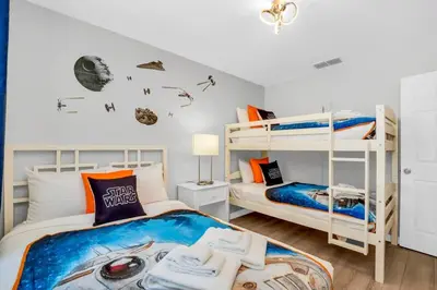 a bedroom with two bunk beds and a room at Roomy Town Home, Mickey-Themed Bedroom! #4BV550 in Kissimmee