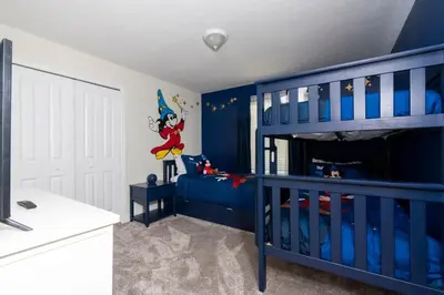 a blue bedroom with a blue bunk bed at Stunning 5 Bd w/ Pool Close to Disney 2905 in Kissimmee