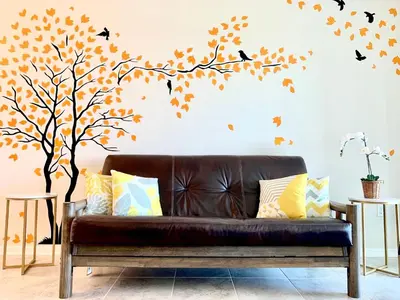 a tree and birds wall sticker in a living room at 3B2B-Beautiful Lake View-Baby Friendly-FREE WATER PARK!NO Resort Fee-5 Miles to Disney-Storey Lake 3141 in Kissimmee