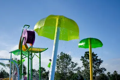a water park with a ride with umbrellas at Magical Adventure Condo w Waterpark near Disney No Resort Fees in Orlando
