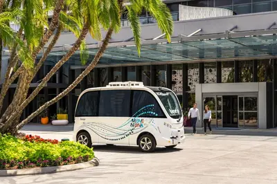 a white van parked in front of a building at Lake Nona Wave Hotel in Orlando