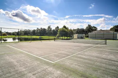 a tennis court with a tennis court at 10 Mi to Disney Venetian Bay Villages Retreat in Kissimmee