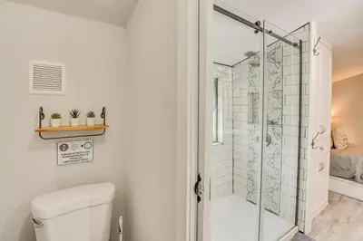 a bathroom with a toilet and a shower at Family Home with Private Pool 24 Mi to Disney! in Saint Cloud