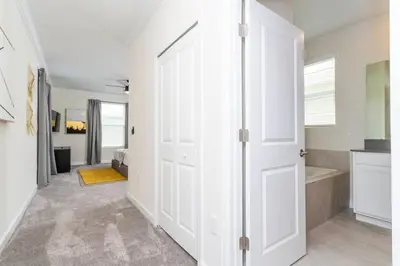 a white door in a room with a bathroom at Gorgeous 5BDR Family with Pool at Storey Lake 2767 O in Kissimmee