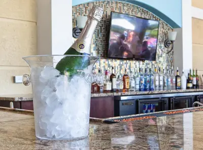 a bottle of champagne sitting on top of a bar at Vista Cay Resort by Millenium at Universal Blvd. in Orlando