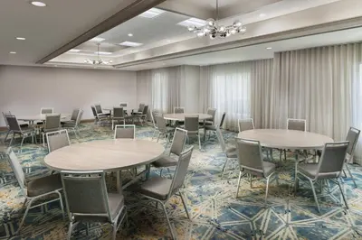 a conference room with tables and chairs in a row at Courtyard by Marriott Orlando Downtown in Orlando