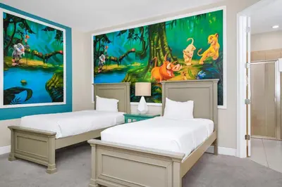 two beds in a room with a painting on the wall at Spectacular Home Near Disney With Private Pool, Movie Theater And Pool Table With Waterpark & Resort Access - 332Sf in Kissimmee