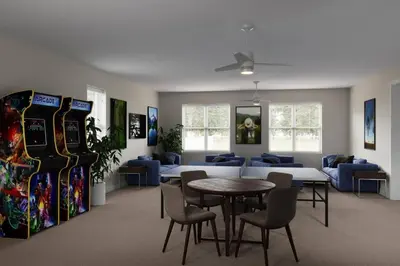 a room with a table and chairs and consoles at Great 4 bedroom townhouse in Hidden Forest, with private pool! in Orlando