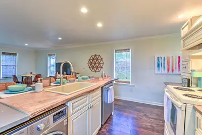 a kitchen with a sink and a counter top at 16 Mi to Disney Cottage with Deck in Winter Garden in Orlando
