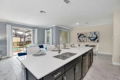 a kitchen with a sink and a counter top at Brand New Storey Lake Resort With Water Slides townhouse in Kissimmee