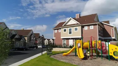 a playground with a slide in a residential neighborhood at Magical Vacation Home 3 min from Disney in Orlando
