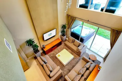 an overhead view of a living room with couches at Beautiful Townhome Overlooking The Lake And The Pool in Orlando