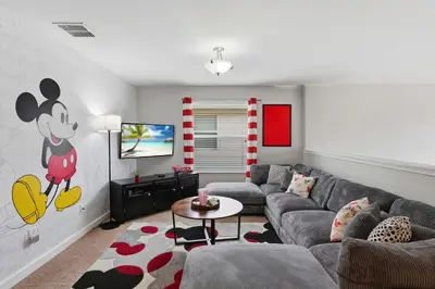 a living room with a couch and a table at Appealing, Large 5BD Home Close to Themed-Parks #5PP961 in Kissimmee