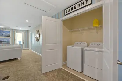 a laundry room with a washer and dryer at Luxury Villa near Disney 8 Bedroom Private Pool & Playground1 in Kissimmee
