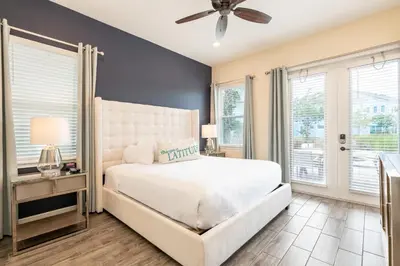 a bedroom with a bed and a ceiling fan at Sunrise Cottage Near Disney With Margaritaville Resort & Island H20 Waterpark Access - 2966Sr in Orlando