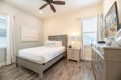 a bedroom with a bed and a ceiling fan at Sunrise Cottage Near Disney With Margaritaville Resort & Island H20 Waterpark Access - 2966Sr in Orlando