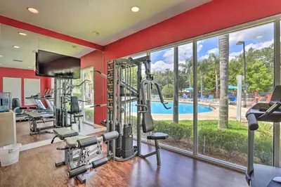 a gym with cardio equipment and a swimming pool at Marvelous 3 Bd Close To Disney @ Lucaya Resort 107 5364 in Kissimmee