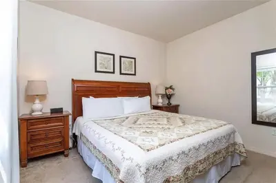 a bedroom with a large bed and two night stands at Marvelous 3 Bd Close To Disney @ Lucaya Resort 107 5364 in Kissimmee