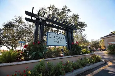 a sign for a library with a sign in a garden at Marvelous 3 Bd Close To Disney @ Lucaya Resort 107 5364 in Kissimmee