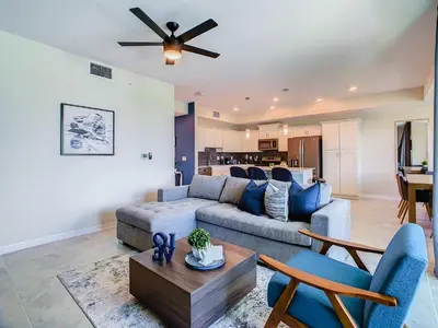 a living room with a couch and a table at Cute Lakeview 2BR Condo with 2 Clubhouses in Kissimmee